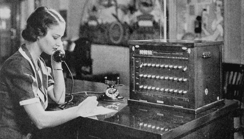 Lady using bell telephone